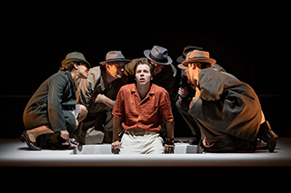 Ed McVey (centre) as Tom Ripley & the cast 