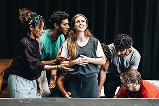 Maisie Smith (centre) & the cast in rehearsal 